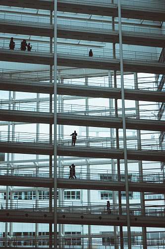 netherlands low-angle photography of people on building building